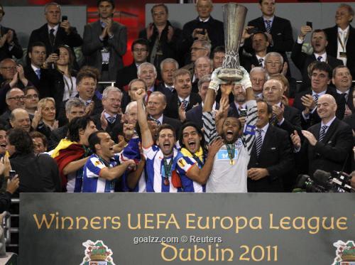 Porto players celebrate as they lift the trophy after beating