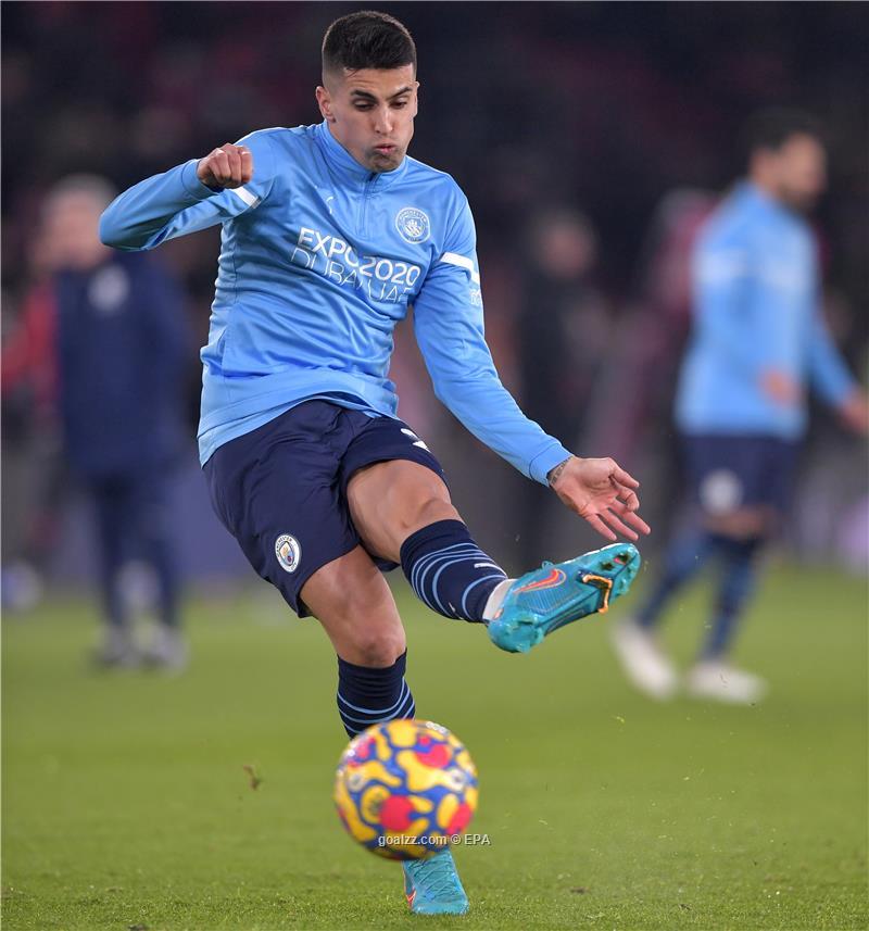 Manchester City's Joao Cancelo heads the ball during the Champions