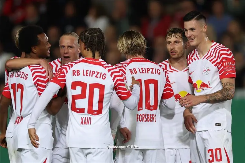 Leipzig's Benjamin Sesko, top, heads the ball during the German